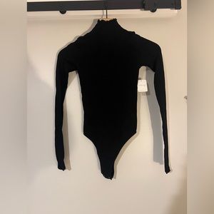 NWT FREE PEOPLE INTIMATELY MOCK NECK SEAMLESS BODYSUIT SIZE M/L IN BLACK
